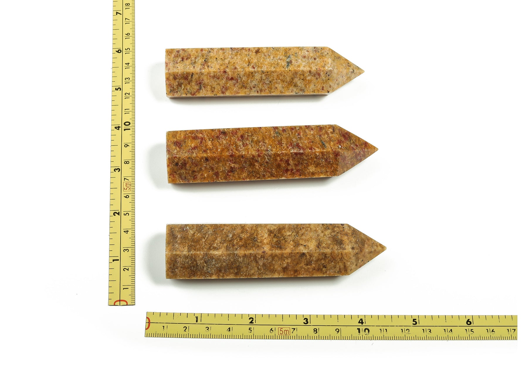 Golden silk jade obelisk tower crystal from GemstoneGO, showcasing a polished, golden-toned jade gemstone with a pointed obelisk shape.