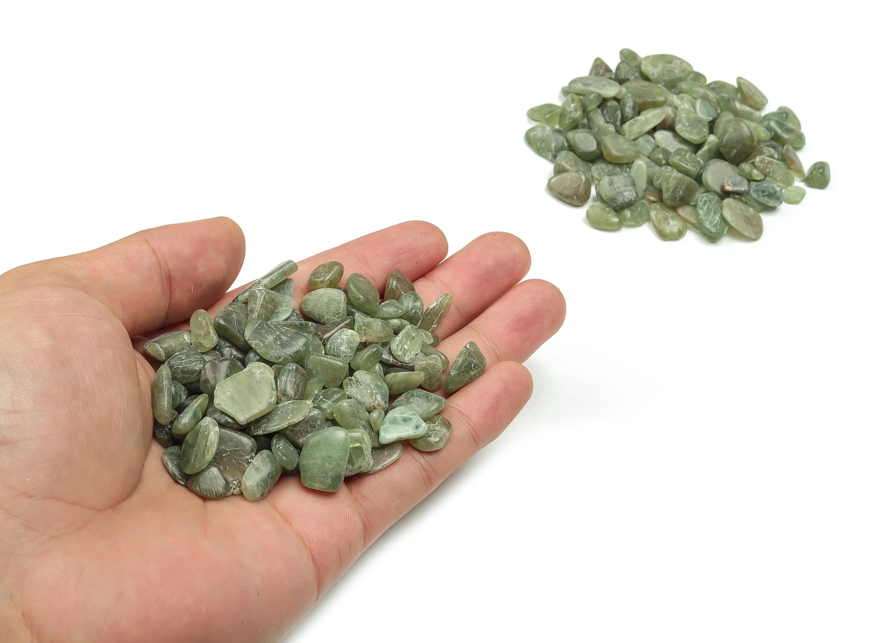Green Apatite crystal chips, semi-tumbled stones in 7-12mm, showcasing vibrant green color and natural mineral texture.