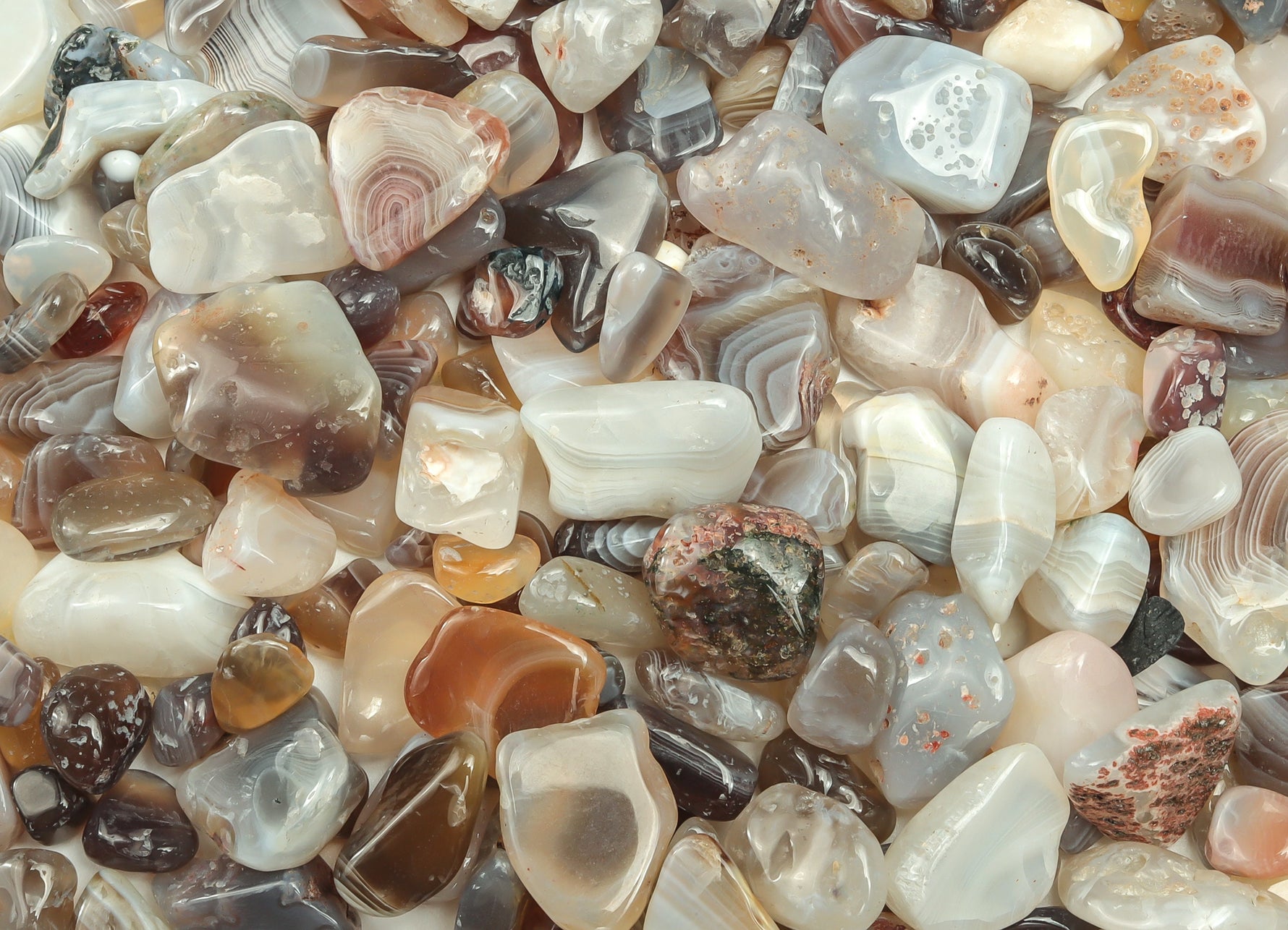 Botswana Agate crystal chips in semi-tumbled 7-12mm size, natural gemstone beads from GemstoneGO, shown in a close-up image.