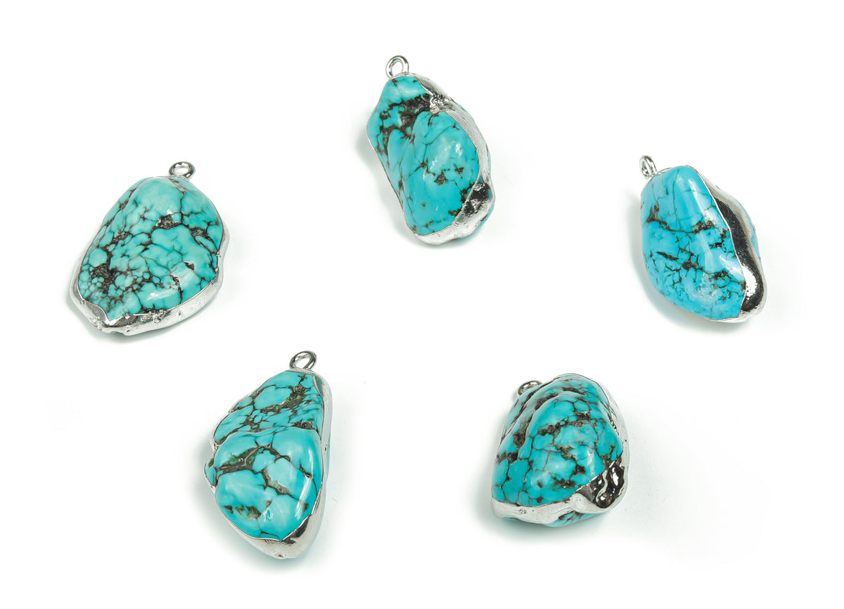 Silver-edged turquoise crystal pendant with vibrant turquoise gemstones, featuring a detailed silver setting from GemstoneGO.