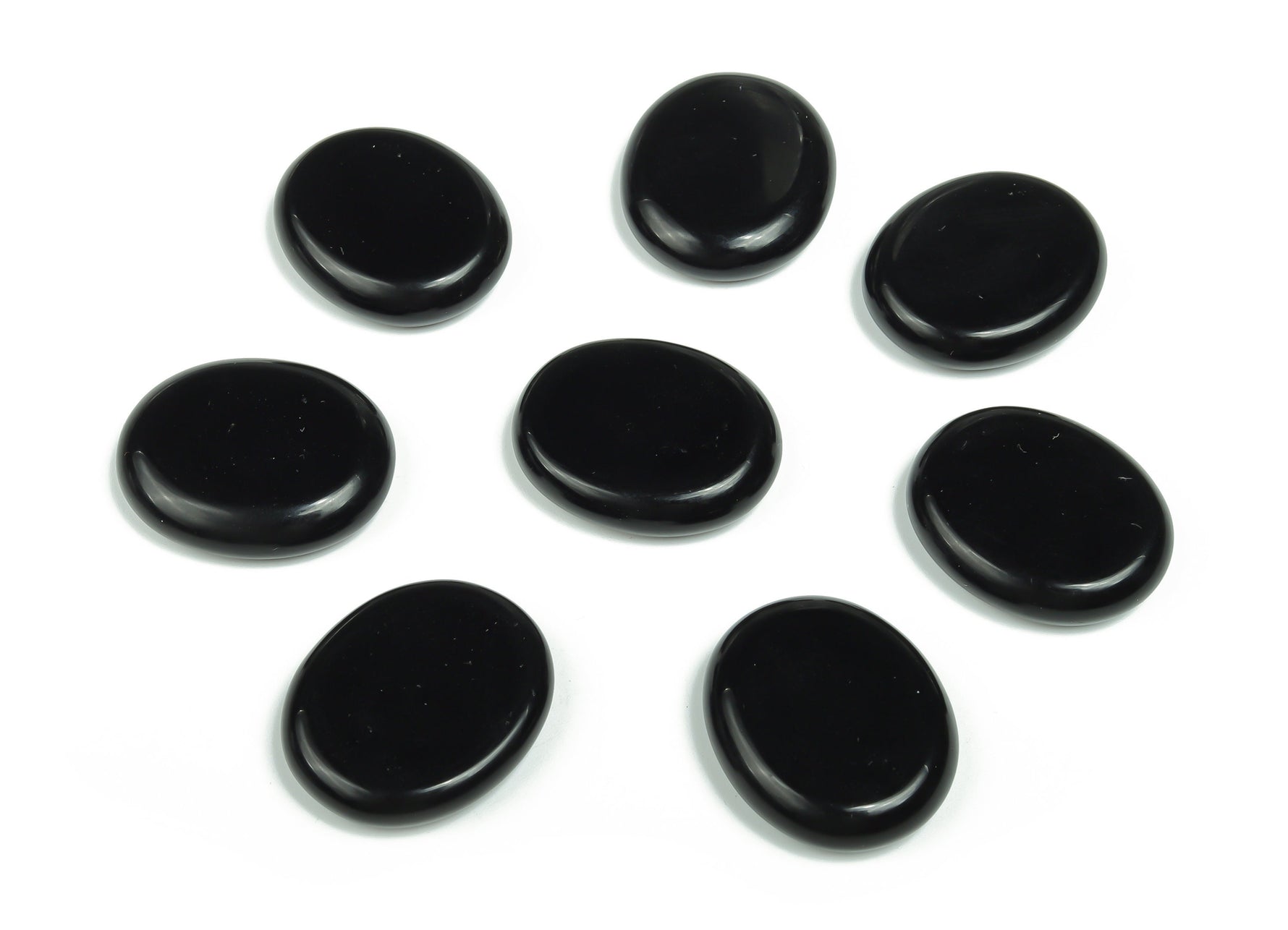 Obsidian flat gemstone slab from GemstoneGO, showcasing smooth black crystal with natural textures, measuring 30x25x7 cm.