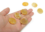 Yellow jade flat gemstone slab with 30x25x7mm dimensions, showcasing vibrant color and smooth surface from GemstoneGO.