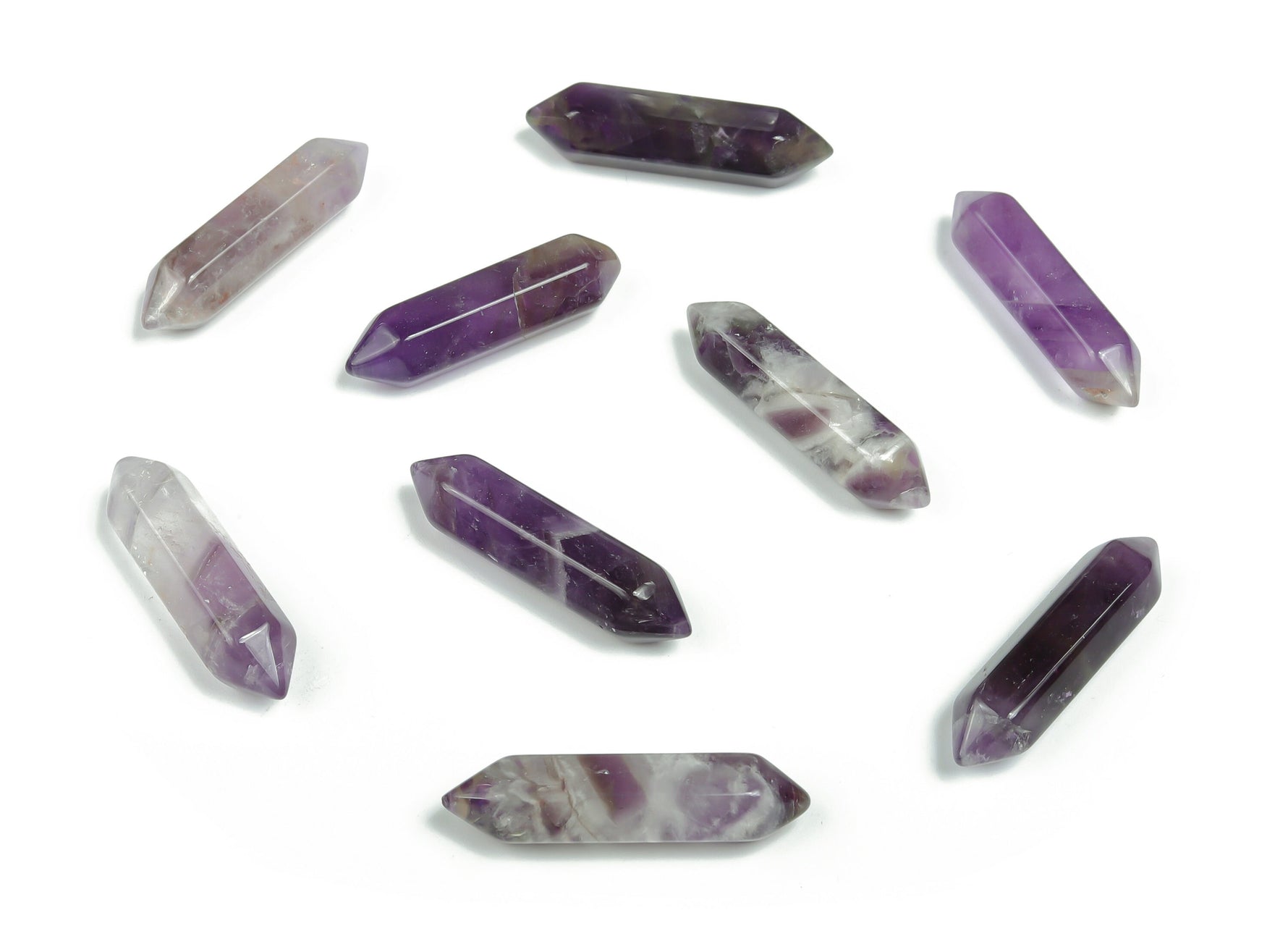 Amethyst terminated carved point gemstone pendant, 33mm, showcasing purple crystal with detailed carvings and pointed tip.