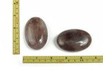 Strawberry Quartz palm gemstone spa stone, 60x40mm, smooth polished natural gemstone with vibrant pink and red hues.
