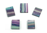 Polished fluorite slice slab gemstone from GemstoneGO, showcasing vibrant green and purple hues with natural banding patterns.