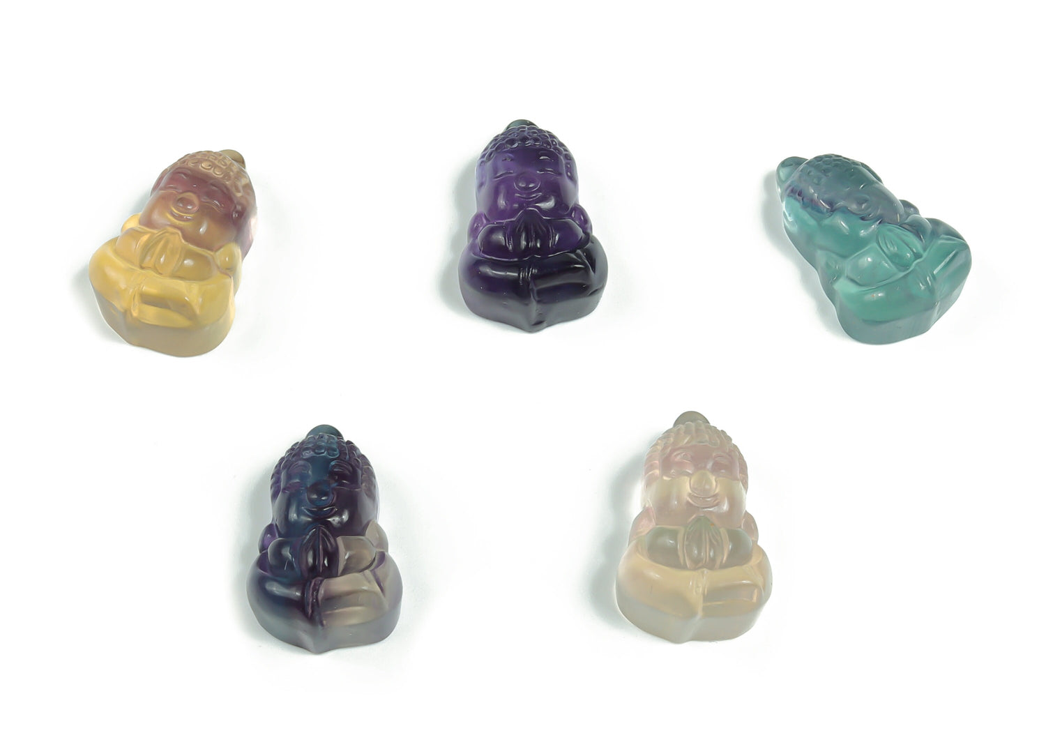 Fluorite Buddha carving gemstone from GemstoneGO, featuring a detailed Buddha figure in vibrant green and purple fluorite.