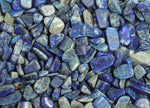 Lapis Lazuli crystal chips, semi-tumbled stones in 7-12mm size, from GemstoneGO, shown in a bulk package.