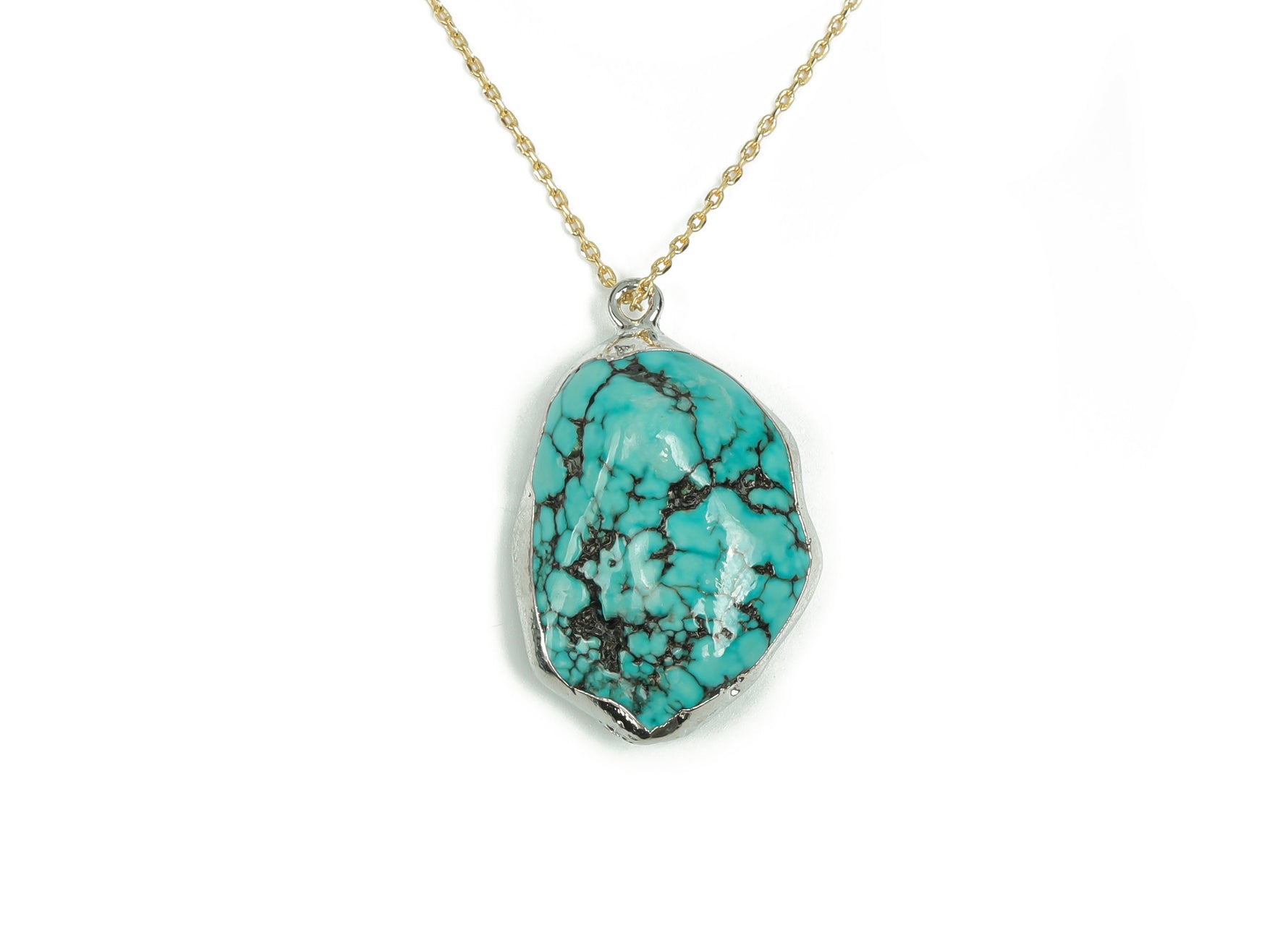Turquoise crystal pendant with silver edge and turquoise gemstones, showcasing a detailed jewelry piece by GemstoneGO.