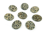 Dalmatian Jasper flat gemstone slab with black spots on beige background, measuring 30x25x7 mm, from GemstoneGO.