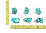 Turquoise crystal pendant with healing stones from GemstoneGO, featuring a polished turquoise gemstone on a silver chain.