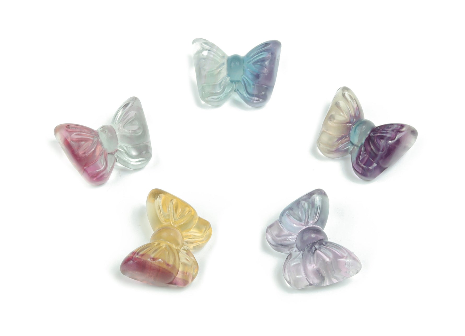 Fluorite butterfly gemstone carving in vibrant purple and green hues, showcasing intricate craftsmanship by GemstoneGO.