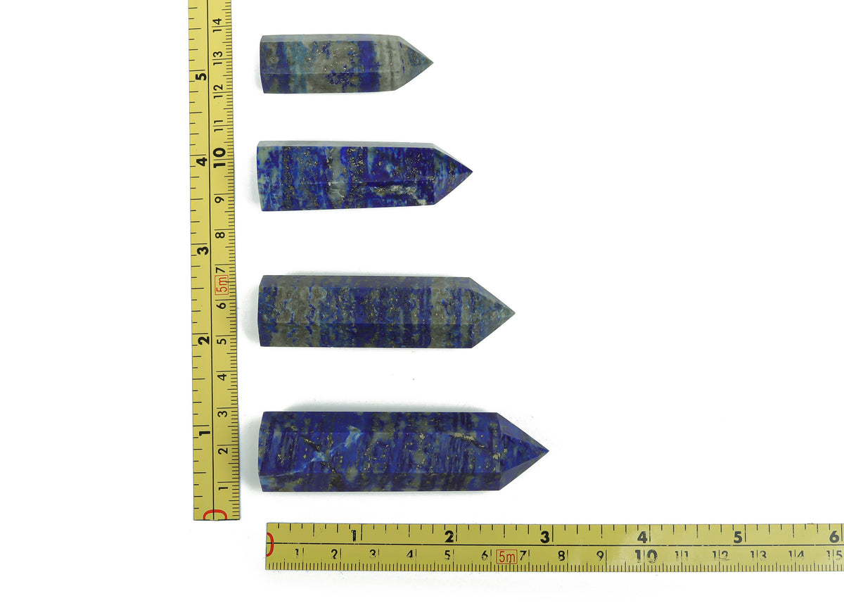 Lapis Lazuli obelisk tower crystal from GemstoneGO, showcasing deep blue stone with gold pyrite inclusions and polished surface.