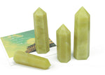Lemon Jade Obelisk Tower crystal from GemstoneGO, showcasing a polished yellow-green gemstone with vertical shape and natural striations.
