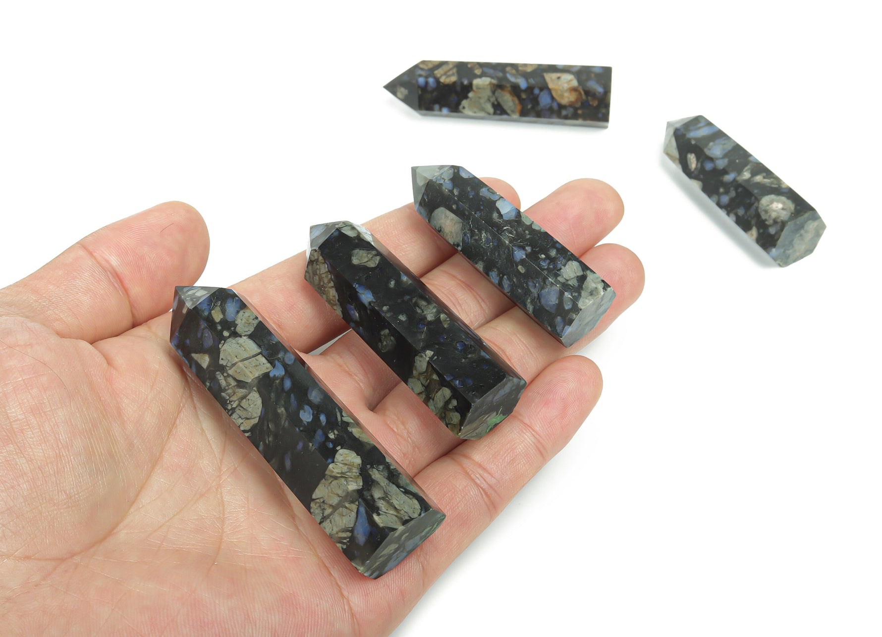 Blue Liberite obelisk tower made of crystal from GemstoneGO, featuring a sleek, polished blue gemstone design.