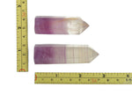 Watermelon Fluorite obelisk tower crystal from GemstoneGO with vibrant green and pink hues, polished pointed gemstone for display or collection.