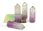 Watermelon Fluorite obelisk tower crystal from GemstoneGO, featuring vibrant green and pink hues and polished stone surface.