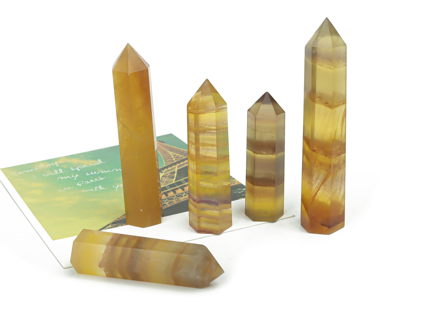 Yellow fluorite obelisk tower crystal from GemstoneGO showing a vibrant yellow crystal with natural striations and smooth polished surfaces.