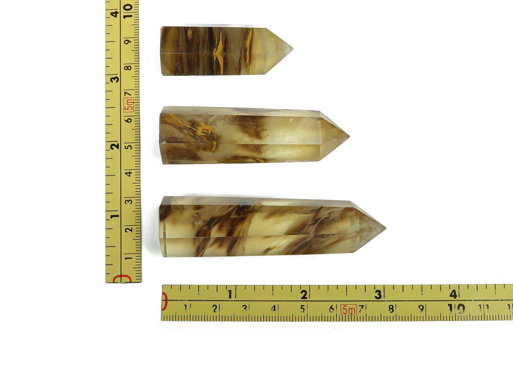 Yellow smelting quartz obelisk crystal tower from GemstoneGO, featuring a pointed quartz crystal with vibrant yellow hues.