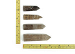 Smoky quartz obelisk tower crystal by GemstoneGO, showcasing a polished, dark gray gemstone with natural crystal formations.