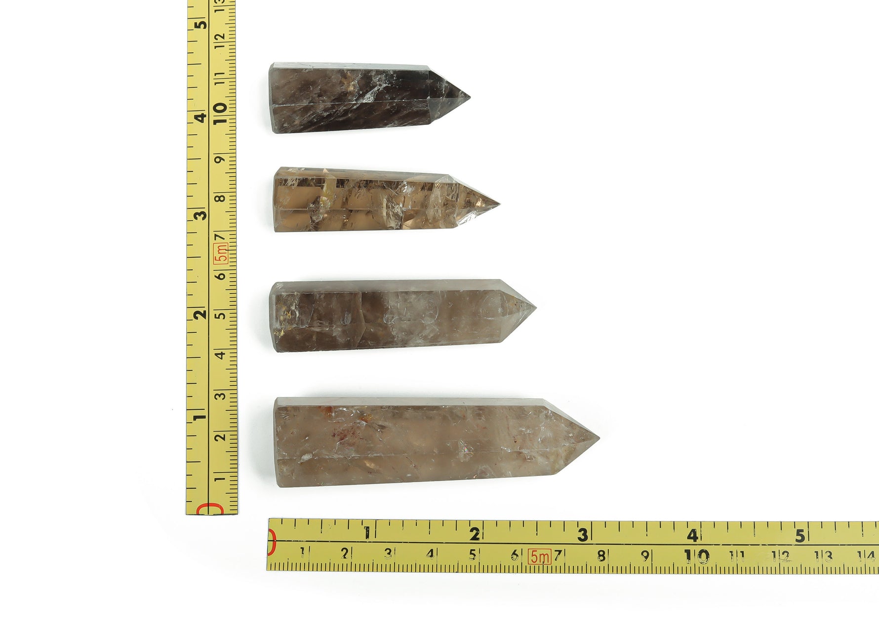 Smoky quartz obelisk tower crystal by GemstoneGO, showcasing a polished, dark gray gemstone with natural crystal formations.