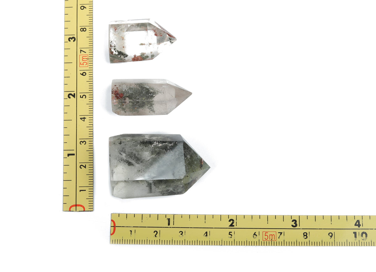 Lodolite Garden Quartz obelisk tower crystal from GemstoneGO with clear and cloudy inclusions, tall and polished for display.