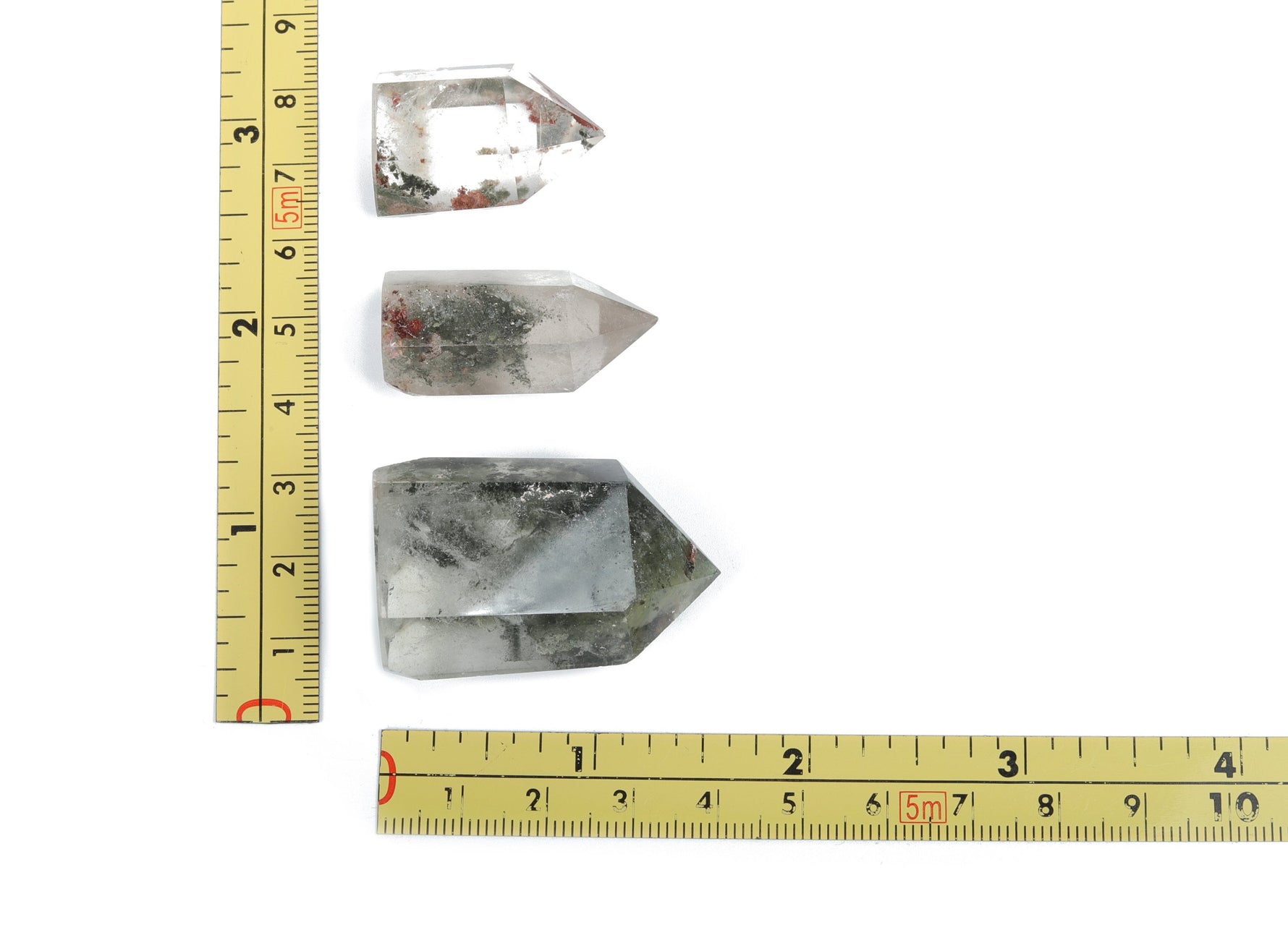 Lodolite Garden Quartz obelisk tower crystal from GemstoneGO with clear and cloudy inclusions, tall and polished for display.