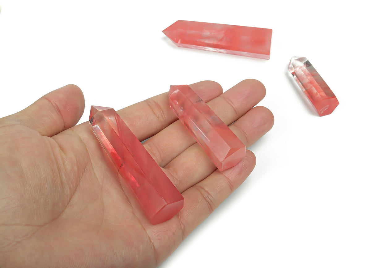 Cherry Quartz obelisk tower crystal from GemstoneGO, showcasing a vibrant red gemstone with a sleek, polished obelisk shape.