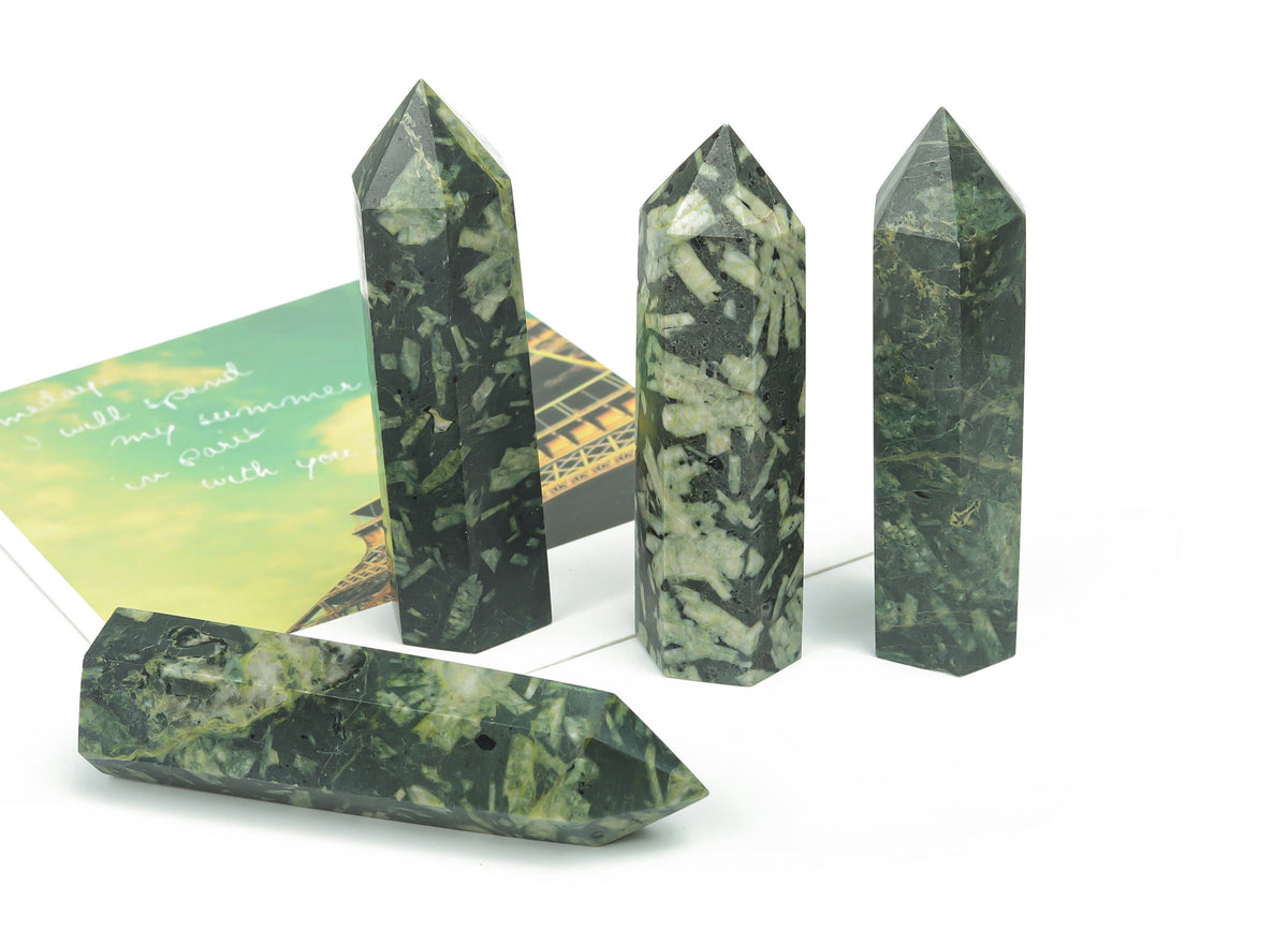 Chinese writing obelisk tower made of chrysanthemum stone crystal, featuring intricate natural patterns and polished surface.