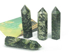 Chinese writing obelisk tower made of chrysanthemum stone crystal, featuring intricate natural patterns and polished surface.