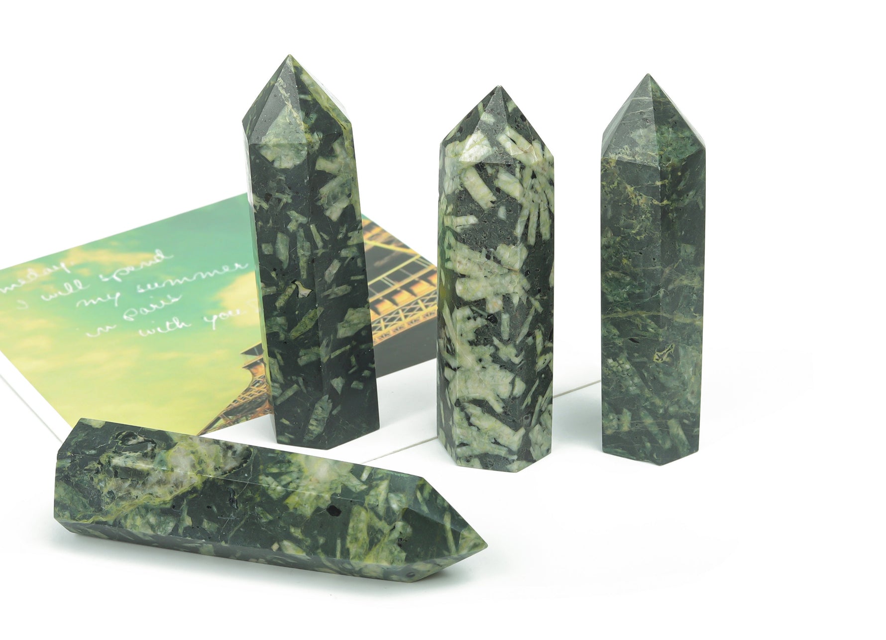 Chinese writing obelisk tower made of chrysanthemum stone crystal, featuring intricate natural patterns and polished surface.
