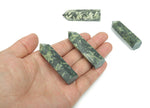 Chinese writing obelisk tower made of chrysanthemum stone crystal, showcasing natural patterns and a polished finish.