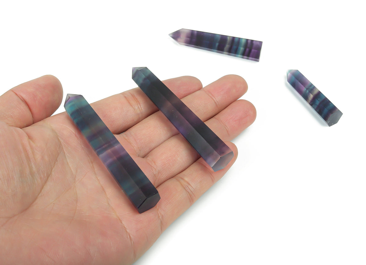 Rainbow fluorite obelisk crystal tower showcasing vibrant rainbow colors and polished gemstone surface, from GemstoneGO.