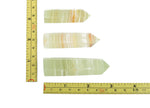 Afghanistan Jade Obelisk Tower Crystal from GemstoneGO, green polished gemstone with obelisk shape and detailed natural stone patterns.
