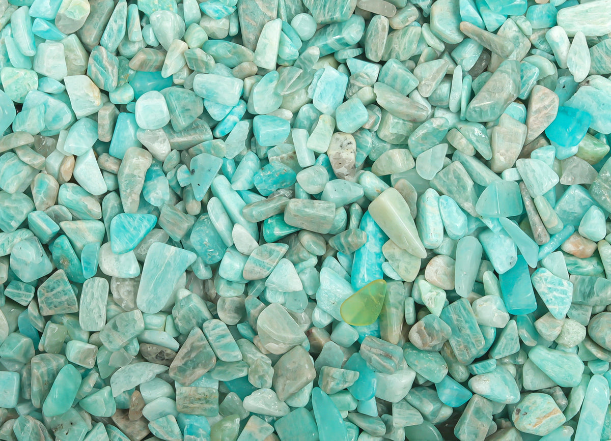 Amazonite crystal chips in various 2-6mm semi-tumbled stones, natural gemstone from GemstoneGO, arranged in a pile.