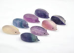 Colorful fluorite hedgehog gemstone carving from GemstoneGO, showcasing vibrant layers and detailed animal sculpture.
