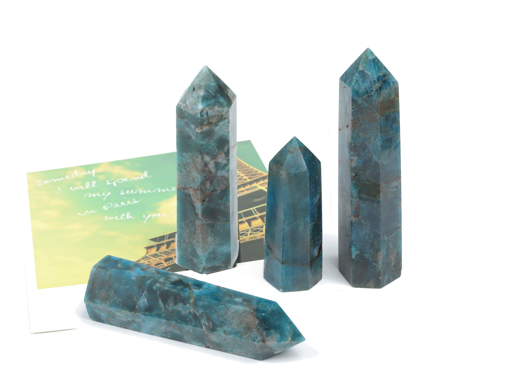 Blue Apatite Quartz obelisk tower crystal from GemstoneGO, showcasing a polished blue gemstone with a pointed tip and smooth surface.