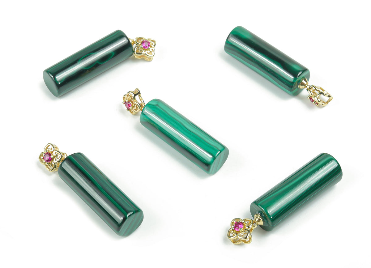 Malachite crystal pendant from GemstoneGO featuring a polished green gemstone with natural banding, ideal for healing and jewelry.