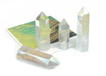 Angel Aura Quartz obelisk tower crystal from GemstoneGO, showcasing a shimmering, luminous crystal with a pointed obelisk shape.