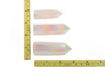 Angel Aura Rose Quartz obelisk tower crystal from GemstoneGO, showcasing a shimmering pink quartz crystal with a polished obelisk shape.