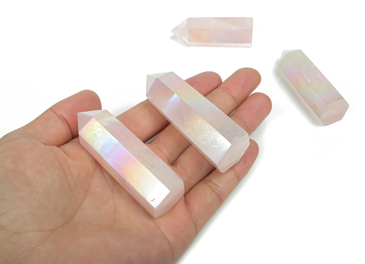 Angel Aura Rose Quartz obelisk tower crystal by GemstoneGO, showcasing a luminous pink crystal with iridescent rainbow hues.