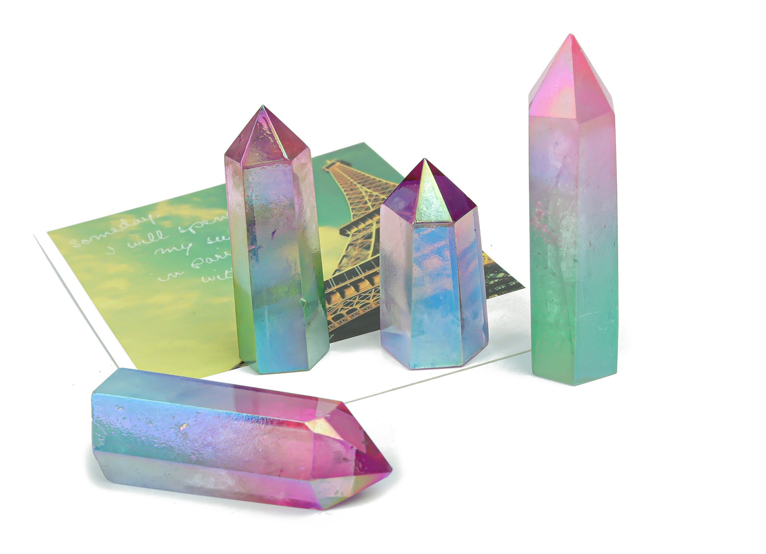 Rainbow Aura Quartz obelisk tower crystal from GemstoneGO, showcasing vibrant rainbow-colored quartz crystal with a pointed tip.