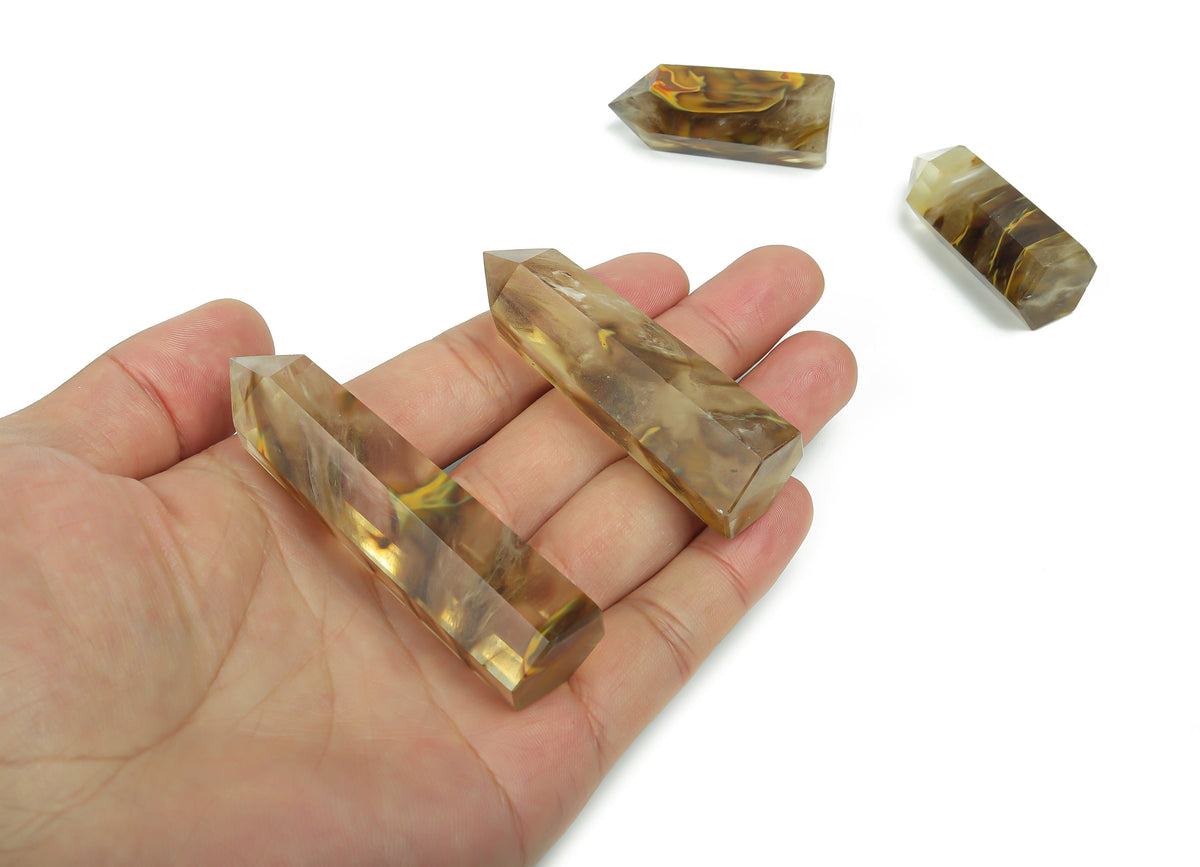 Yellow smelting quartz obelisk tower crystal with natural polished surface, crafted by GemstoneGO for decorative and healing purposes.