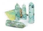Phoenix Obelisk Tower Crystal from GemstoneGO, featuring a clear quartz crystal with a pointed obelisk shape and intricate natural details.