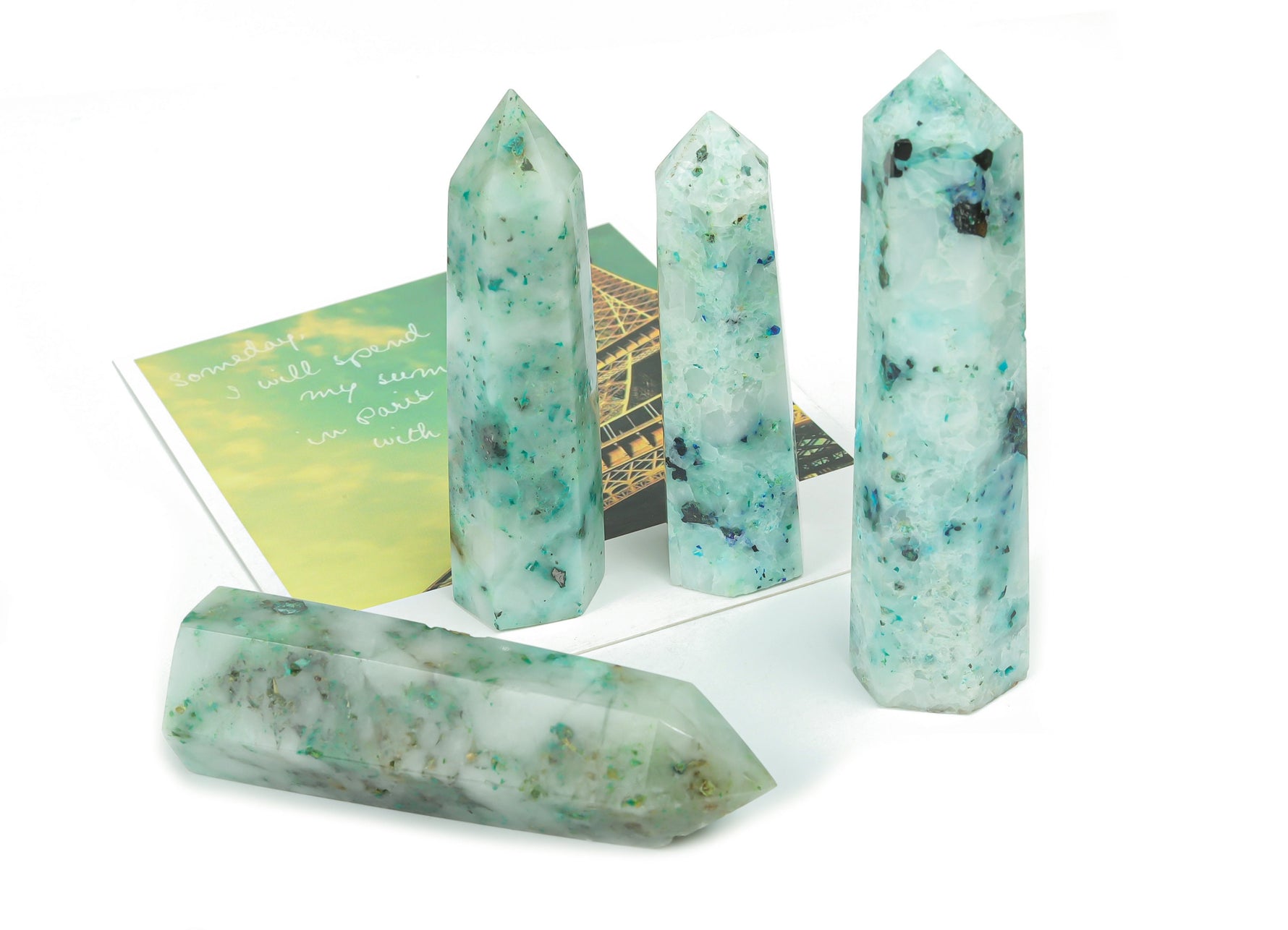 Phoenix Obelisk Tower Crystal from GemstoneGO, featuring a clear quartz crystal with a pointed obelisk shape and intricate natural details.
