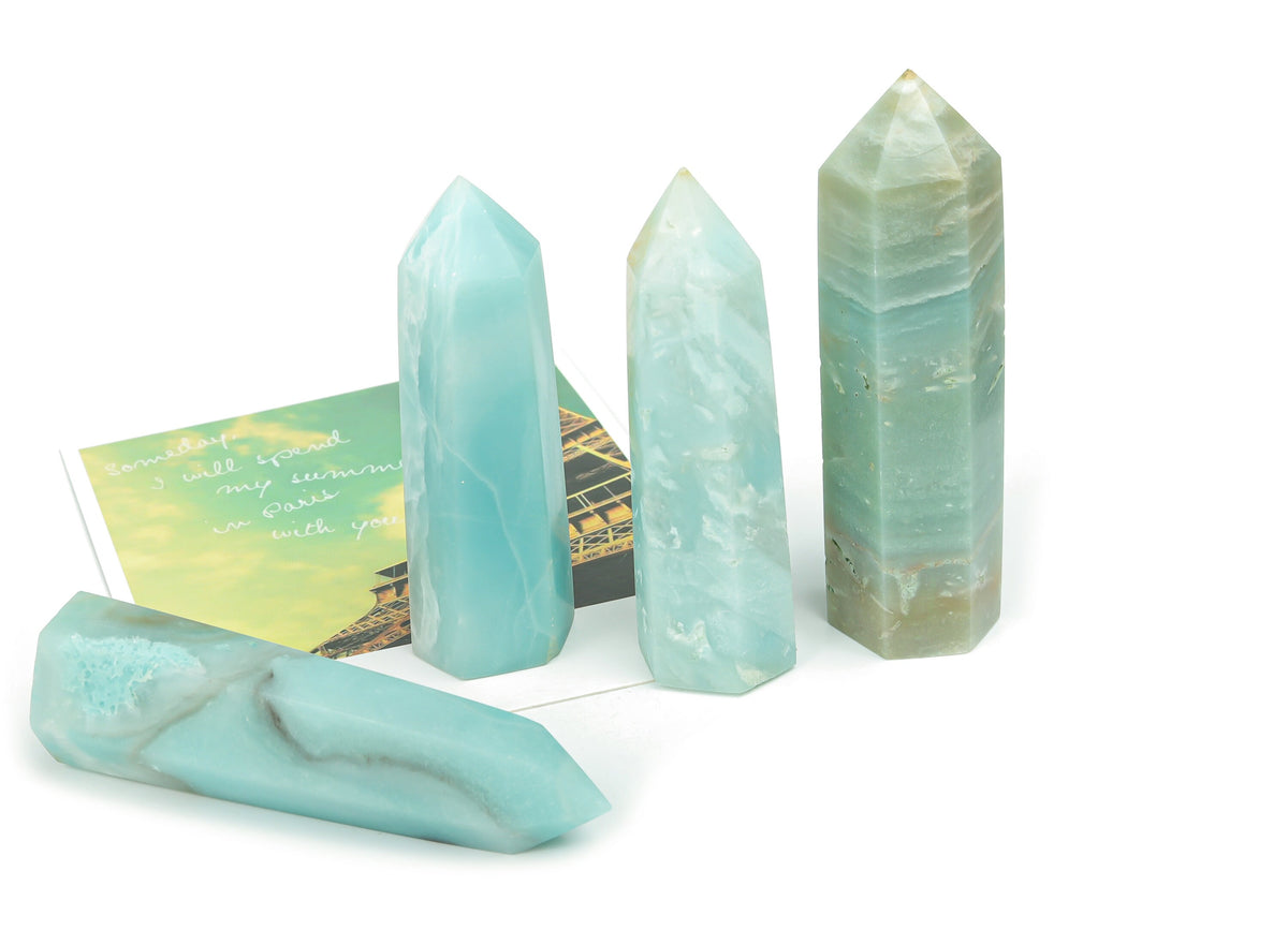Amazonite obelisk tower crystal from GemstoneGO, showcasing its blue-green mineral structure and polished geometric shape.