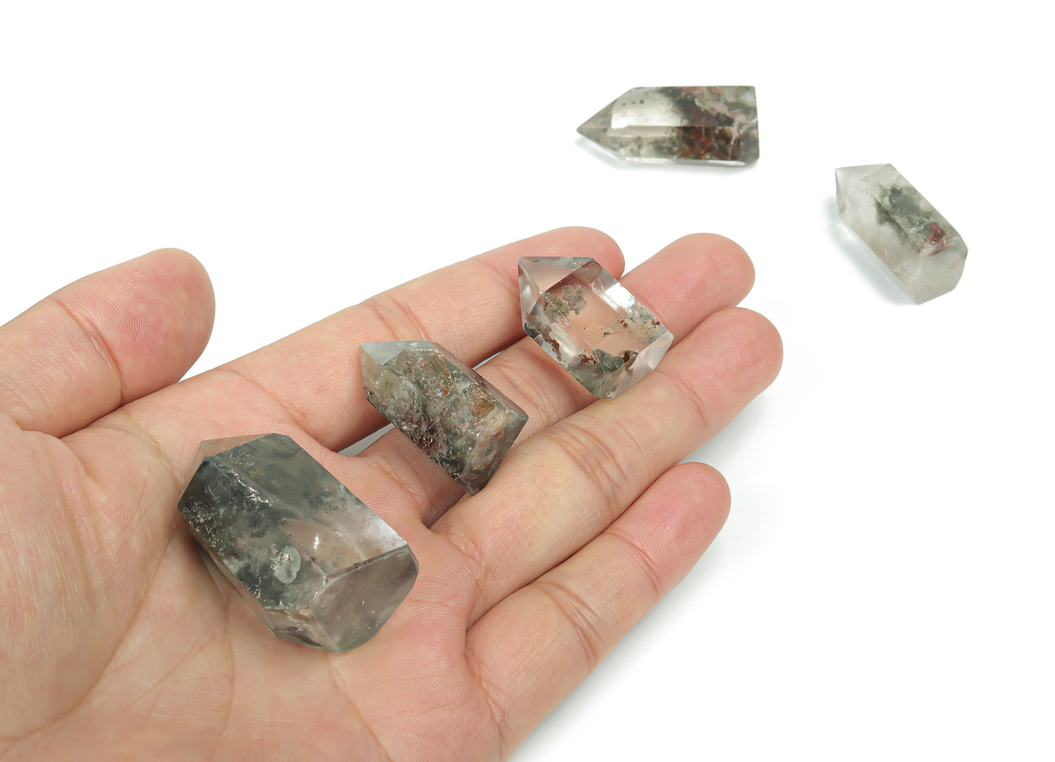 Lodolite Garden Quartz obelisk crystal tower by GemstoneGO, featuring clear quartz with mineral inclusions, standing upright.