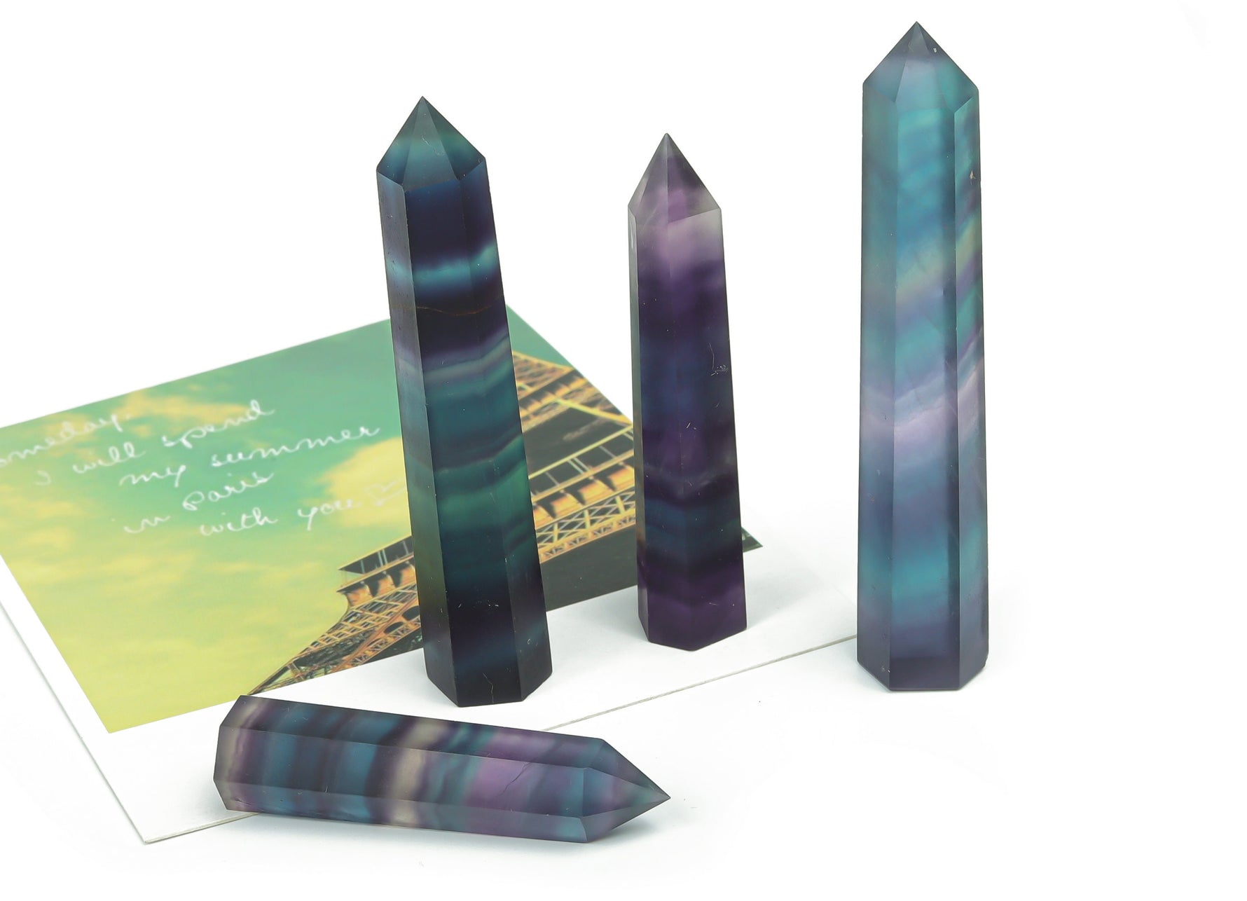 Rainbow fluorite obelisk tower crystal from GemstoneGO, showing vibrant rainbow hues and polished stone surface.