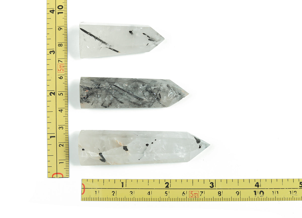 Tourmalinated Quartz obelisk tower crystal from GemstoneGO, featuring black tourmaline inclusions in clear quartz.