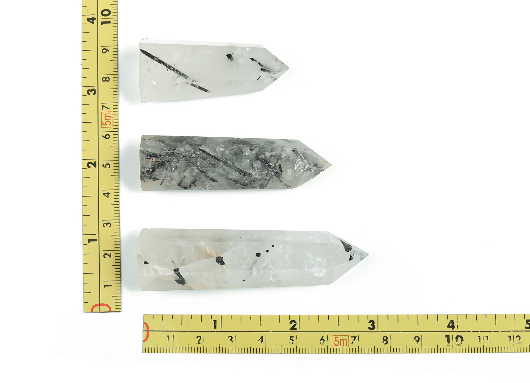 Tourmalinated Quartz obelisk tower crystal from GemstoneGO, featuring black tourmaline inclusions in clear quartz.