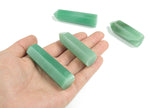 Aventurine obelisk tower crystal from GemstoneGO with green stone and polished pointed shape, showcasing smooth surface and natural texture.